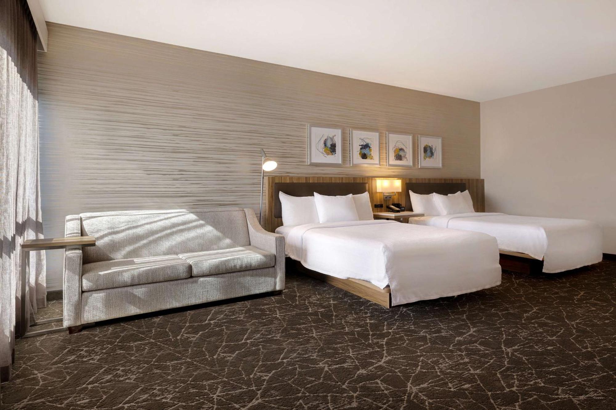 Deluxe Queen Room with Two Queen Beds and Sofa Bed